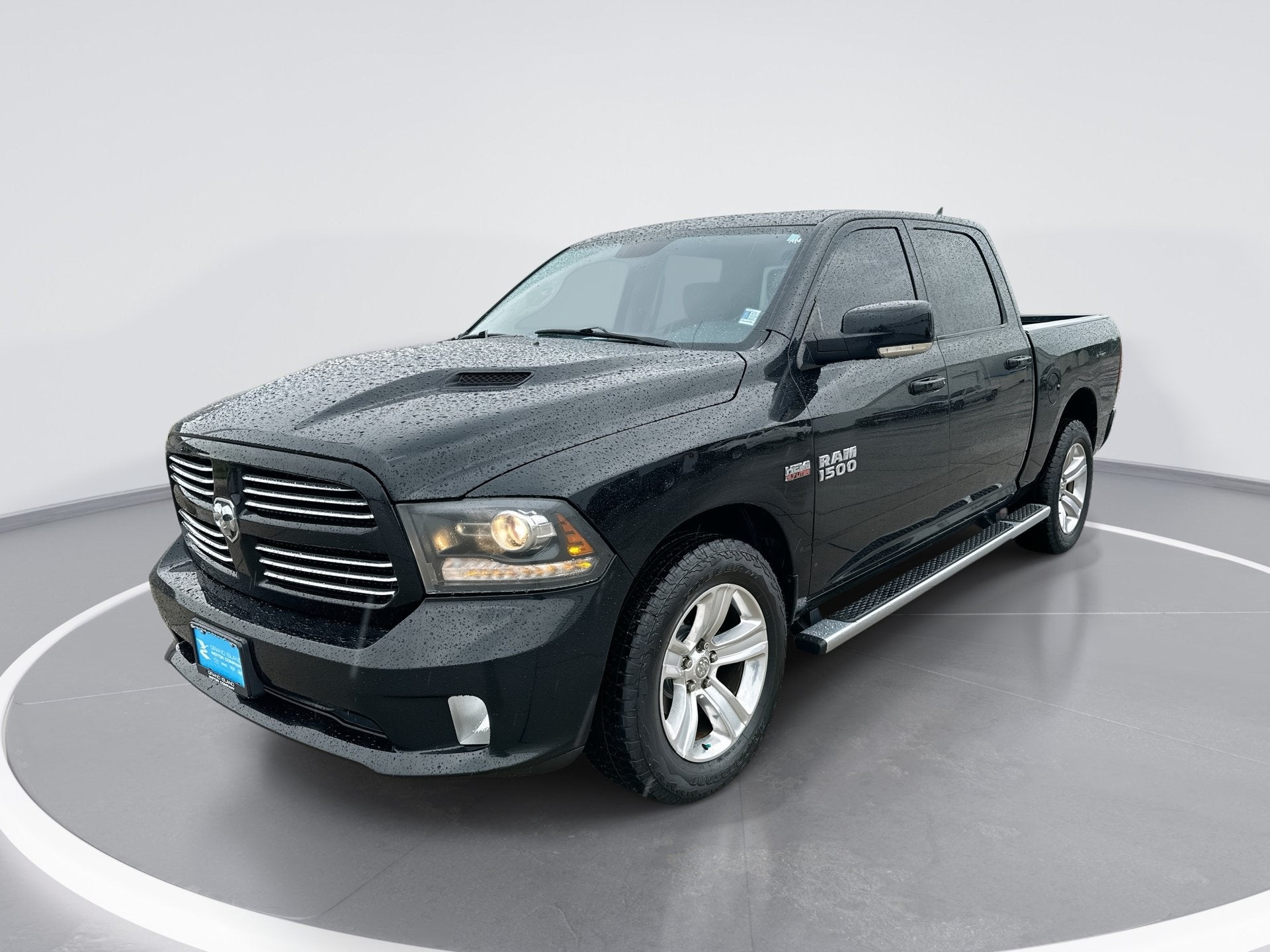 2013 RAM 1500 Sport in Black — front three-quarter view
