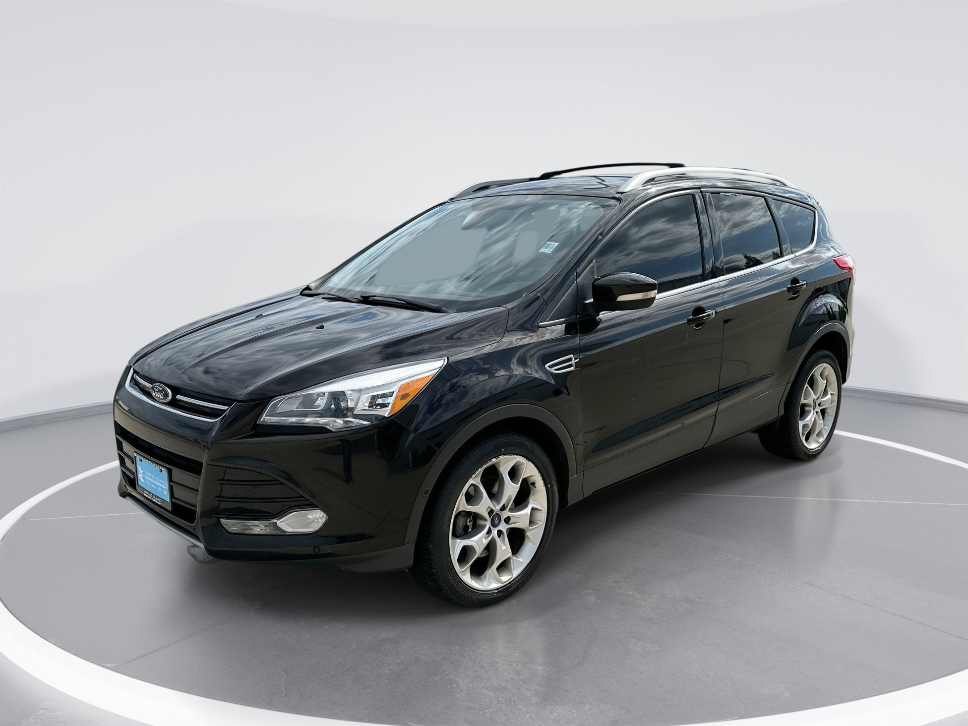 2013 Ford Escape Titanium in Kodiak Brown Me — front three-quarter view