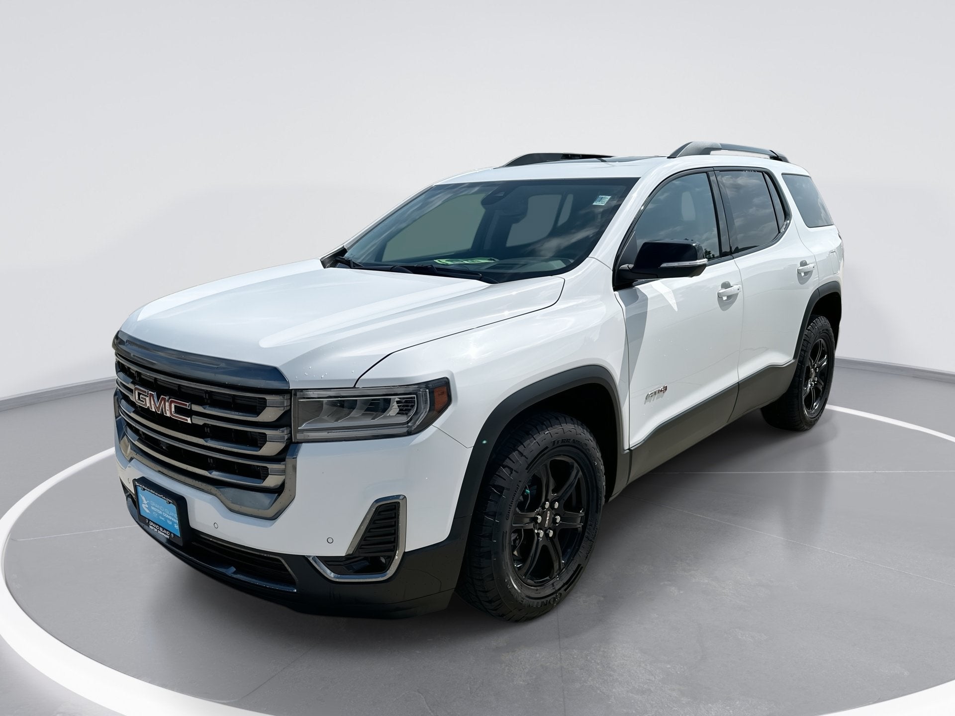 2022 GMC Acadia AT4 in Summit White — front three-quarter view