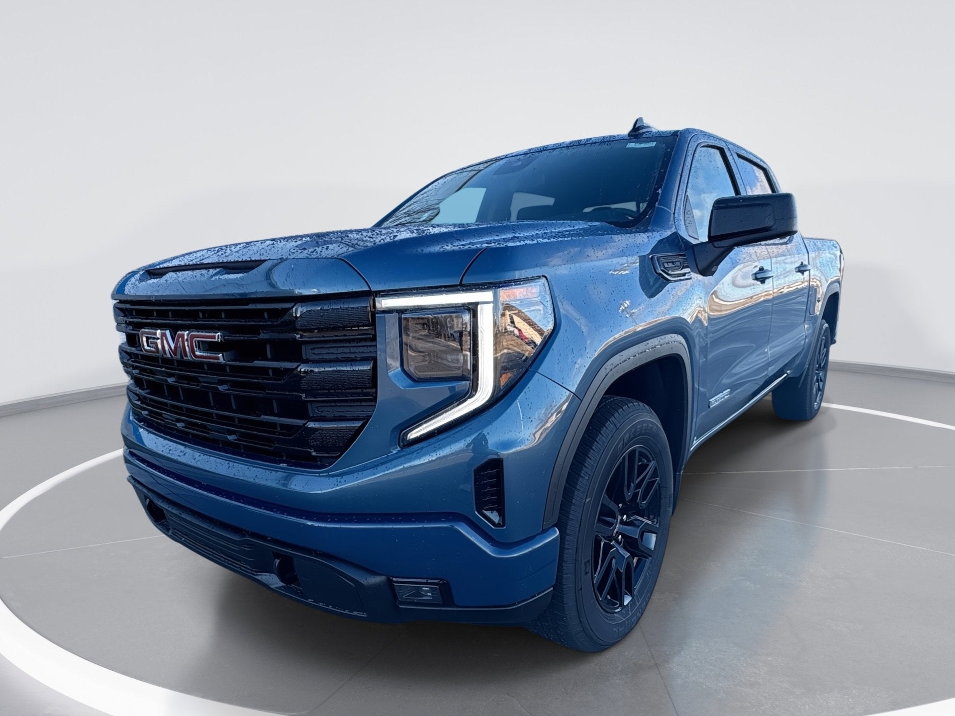 2026 GMC Sierra 1500 Elevation in Downpour Metallic — front three-quarter view